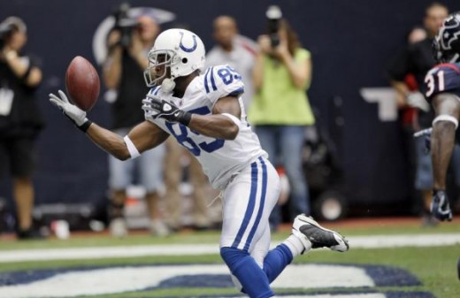 Indianapolis Colts wide receiver Pierre Garcon (85) makes a 9-yard touchdown reception as Houston Texans safety Bernard Pollard, right, defends during the second quarter of an NFL football game Sunday, Nov. 29, 2009 in Houston. (AP Photo/David J. Phi