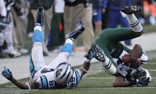 New York Jets cornerback #24 Darrelle Revis comes down with pass intended for Carolina Panthers' #89 Steve Smith for an interception in the second quarter. (AP Photo/Julie Jacobson)