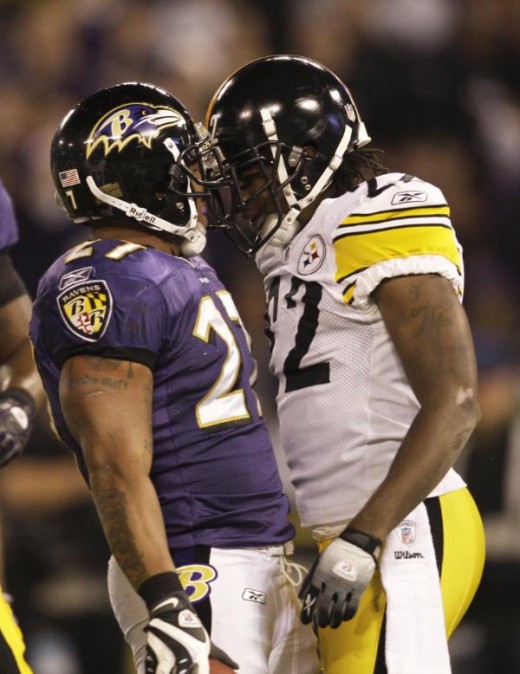 Baltimore Ravens running back Ray Rice, left, and Pittsburgh Steelers cornerback William Gay, right, talk after Rice carried the play during the first half of an NFL football game, Sunday, Nov. 29, 2009, in Baltimore. (AP Photo/Rob Carr)