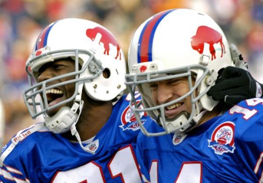 Terrell Owens with Ryan Fitzpatrick on his 31-yard touchdown run  (AP Photo/Don