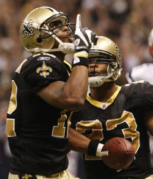 Marques Colston, left, celebrates his 20-yard touchdown pass with Pierre Thomas during the fourth quarter of an NFL football game against the New England Patriots, Monday, Nov. 30, 2009, in New Orleans. (AP Photo/Dave Martin)