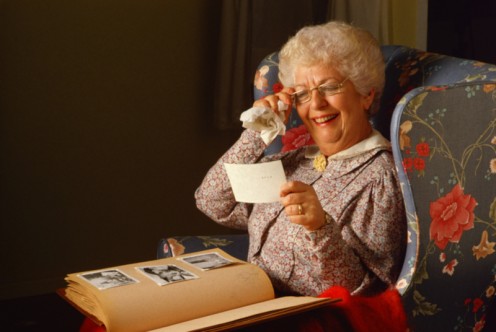 A grandmother enjoys her memory book.
