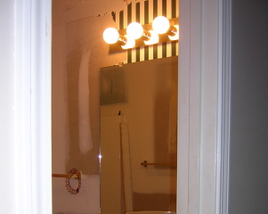Before: ugly wallpaper and outdated fixtures