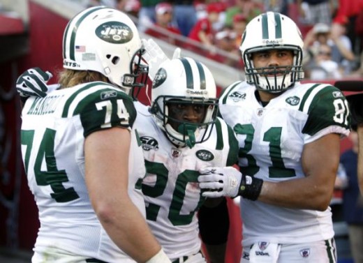 Thomas Jones (20) celebrates with teammates Nick Mangold (74) and Dustin Keller (81) following his second touchdown of an NFL football game during the fourth quarter on Sunday, Dec. 13, 2009, in Tampa, Fla. (AP Photo/Brian Blanco)