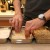 Dipping the chicken in the cream of chicken and milk mixture Dipping the chicken in the cream of chicken and milk mixture