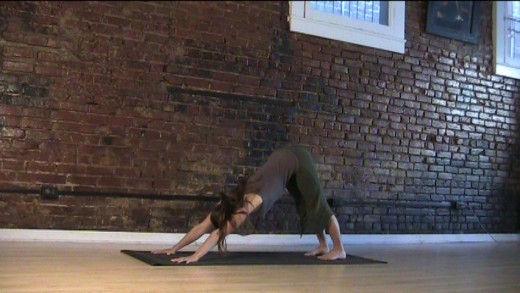 Downward Dog - Be sure to keep the lower back long. Bend your knees if you have to. Your heels don't have to touch the floor.