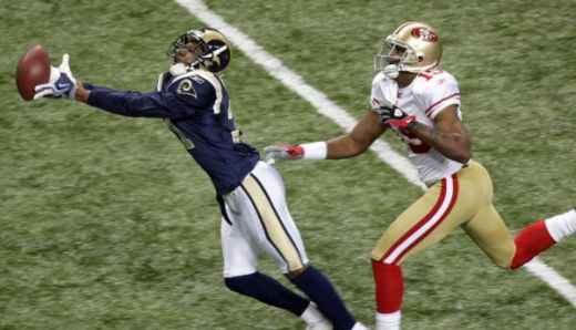 St. Louis Rams cornerback Justin King, left, nearly intercepts a pass intended for San Francisco 49ers wide receiver Michael Crabtree, right, during the third quarter of an NFL football game Sunday, Jan. 3, 2010, in St. Louis. San Francisco won 28-6.