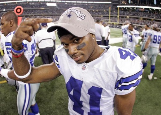 Dallas Cowboys cornerback Terence Newman (41) points to his NFC East Champion cap after an NFL football game against the Philadelphia Eagles, Sunday, January 3, 2010 at Cowboys Stadium in Arlington, Texas. The Cowboys won the game, 24-0. (AP Photo/Ja