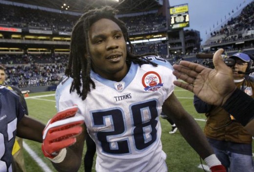 Tennessee Titans' Chris Johnson is congratulated after an NFL football game against the Seattle Seahawks, Sunday, Jan. 3, 2010, in Seattle. The Titans won 17-13. On Sunday, Johnson became the sixth player in NFL history to rush for 2,000 yards in a s