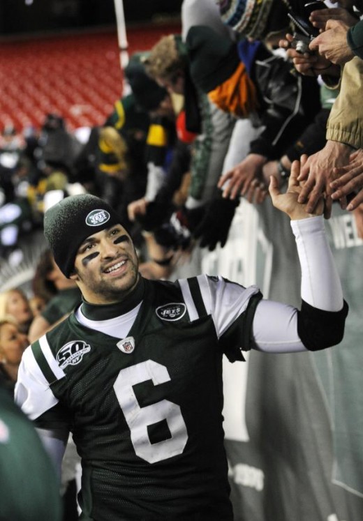 New York Jets quarterback Mark Sanchez greets fans after the Jets beat the Cincinnati Bengals 37-0 in an NFL football game at Giants Stadium in East Rutherford, N.J., Sunday, Jan. 3, 2010. The Jets won 37-0. (AP Photo/Bill Kostroun)