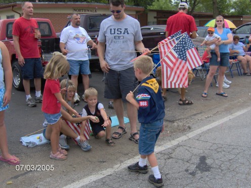 A fourth of July Parade, giving out candy to the kids