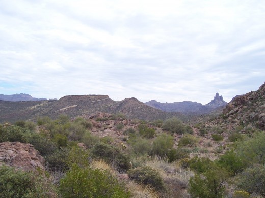 A view of the Superstitions from the inside. Two treasure hunting landmarks, Weavers Needle (extreme right) and Black-Top Mesa
