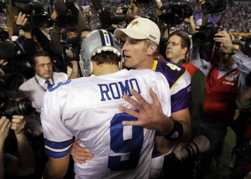 Minnesota Vikings' Brett Favre talks to Dallas Cowboys' Tony Romo (9) after the second half of an NFL divisional playoff football game Sunday, Jan. 17, 2010, in Minneapolis. The Vikings won 34-3. (AP Photo/Paul Sancya)