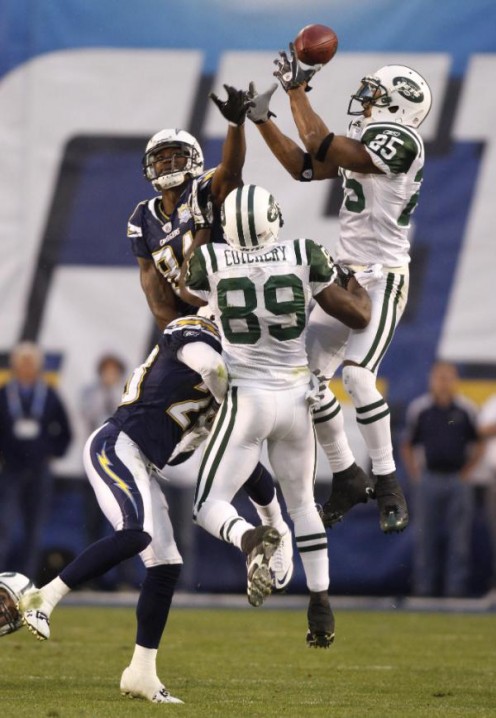 New York Jets safety Kerry Rhodes (25) reaches for an onside kick by the San Diego Chargers in the fourth quarter of an NFL divisional playoff football game, Sunday, Jan. 17, 2010, in San Diego. The Jets won 17-14. (AP Photo/Denis Poroy)