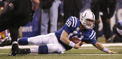 Peyton Manning slides to the turf at Lucas Field Stadium (Sam Riche/The Indianapolis Star
