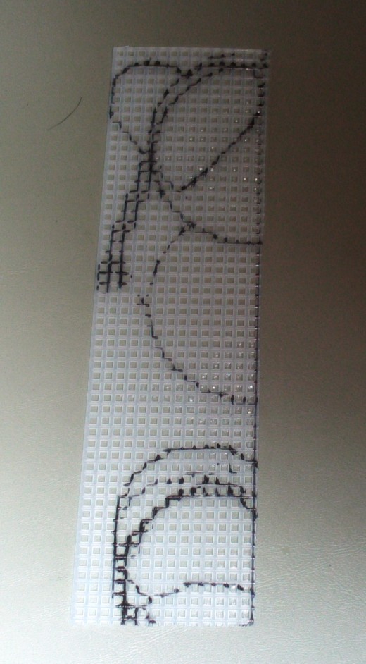 Cut out the bookmark shape out of the plastic canvas mesh.