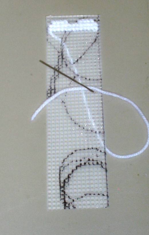 Here I begin to stitch on the white heart.