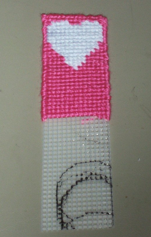 Here the bookmark is now halfway cross stitched on, and looking very nice indeed.