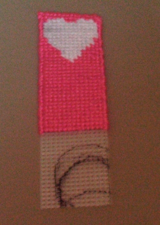 Here the book mark is over half way cross stitched.