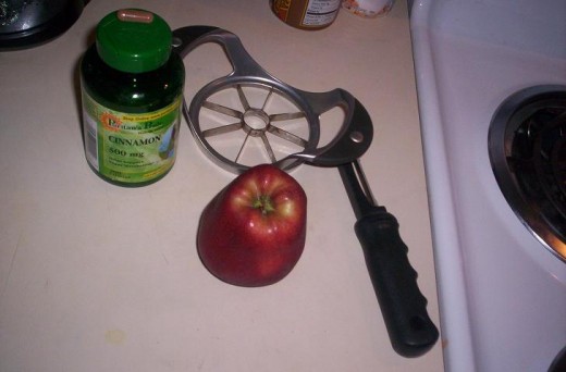 Corer/slicer, peeler, knife, and cinnamon.