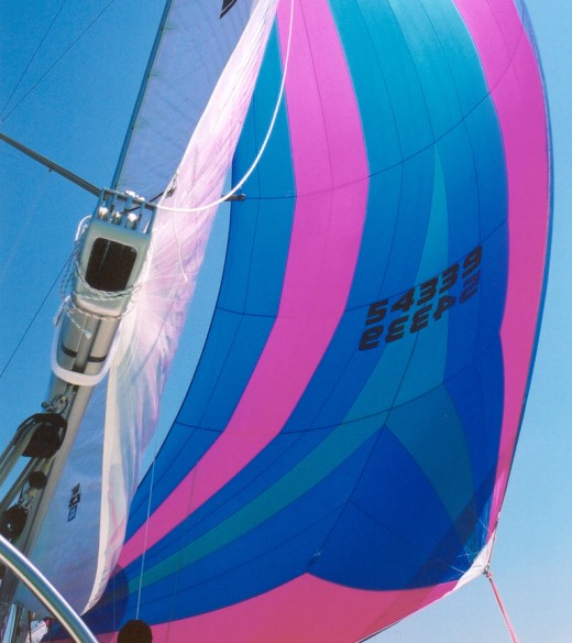 Colorful sailboat sail with royal blue, aqua and bright pink