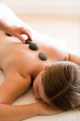 Back massage treating lumbar L1-L5 areas.
