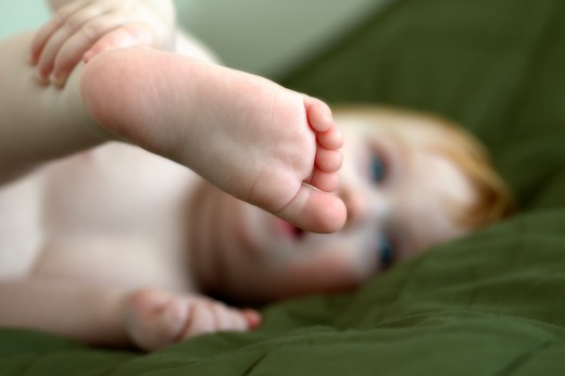 No, the baby isn't getting a tattoo...some words to go along with a footprint tattoo could be your baby's name or nickname.