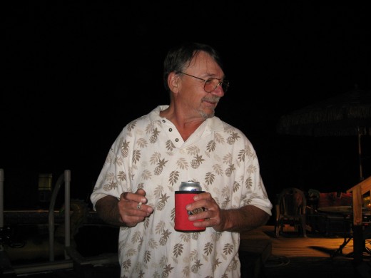 Husband Johnny enjoying a brew while waiting for the fish to get done.