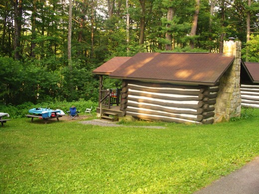 A picturesque log cabin nestled on the ridge of a mountain that sleeps four comfortably.