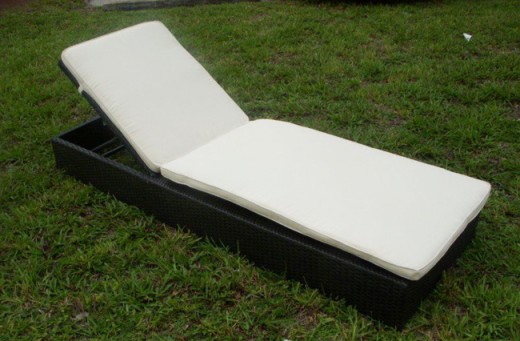 Outdoor wicker chaise lounges are adjustable for sitting up, reading and sleeping while enjoying the backyard resort.