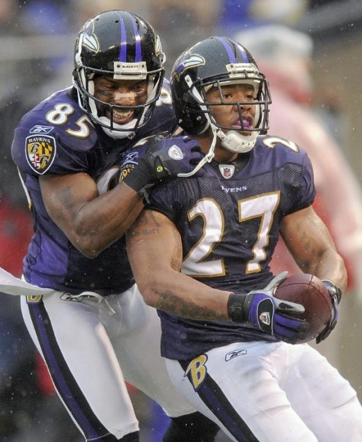 Baltimore Ravens wide receiver Derrick Mason, left, celebrates running back Ray Rice's, right, second-quarter touchdown during an NFL football game against the Detroit Lions, Sunday, Dec. 13, 2009, in Baltimore. (AP Photo/Nick Wass)