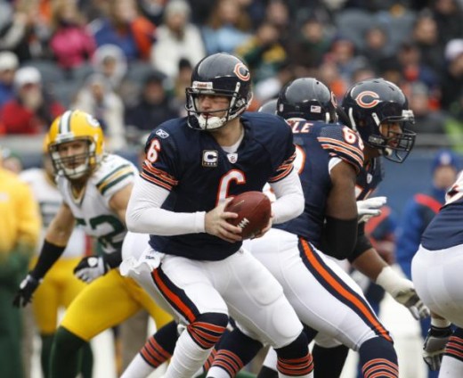 Chicago Bears quarterback Jay Cutler (6) takes a snap against the Green Bay Packers during the first half of an NFL football game in Chicago Sunday, Dec. 13, 2009. (AP Photo/Nam Y. Huh)