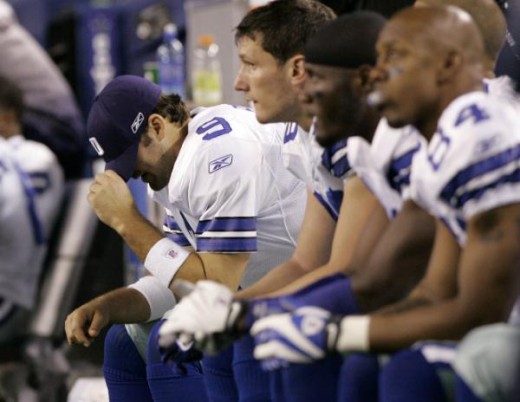 Dallas Cowboys quarterback Tony Romo (9) pulls his cap over his face as the their NFL football game against the San Diego Chargers winds down, Sunday, Dec. 13, 2009 in Arlington, Texas. The Cowboys lost 20-17. (AP Photo/Amy Gutierrez)