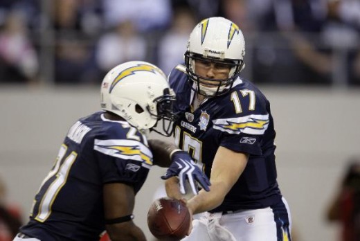 San Diego Chargers running back LaDainian Tomlinson (21) take the handoff from quarterback Philip Rivers (17) during an NFL football game against the Dallas Cowboys, Sunday, Dec. 13, 2009, in Arlington, Texas. (AP Photo/Tony Gutierrez)