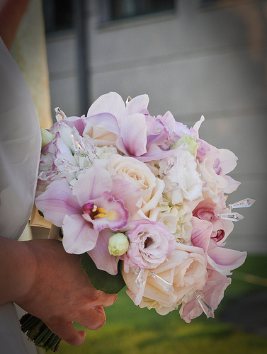 Rose and orchid bridal bouquet with crystals.