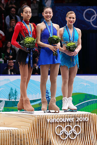 FIGURE SKATING LADIES WINNERS  Kim Yu-Na in the middle (gold)   Mao Asada (wearing red and black) -- Japan (silver)   Joannie Rochette -- Canada (bronze)