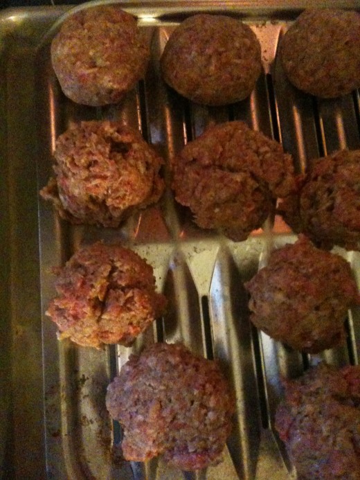 Use an ice cream scooper to make your meatballs. They're all even that way, so they cook at the same rate. The ones on top have been rolled, so they will hold together.