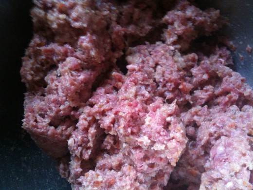Mix the seasonings into the ground beef well, but don't overmix. That will keep them tender. This is mixed and ready to go.