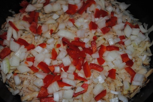Layer in potatoes, onions and peppers.