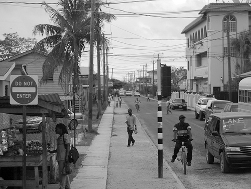 A very nice black and white shot of a street in Belize City.