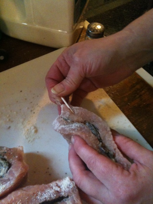 Once filled, seal the open edge of the pocket with a couple of toothpicks. Use a zig zag motion to catch as much meat as possible.