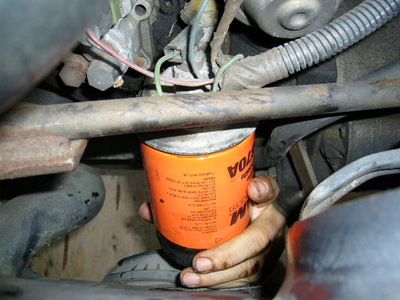 Screw on New Oil Filter (autorepair.about)