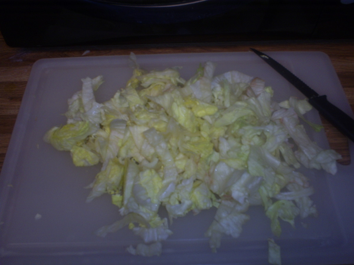 Cut the lettuce on a cutting board.