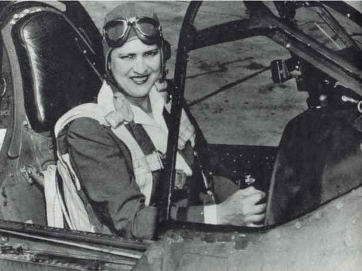 PHOTO Jackie Cochran in the cockpit of a P-40 fighter plane, she was head of the Women Airforce Service Pilots (WASP). [Photos this page, public domain.]
