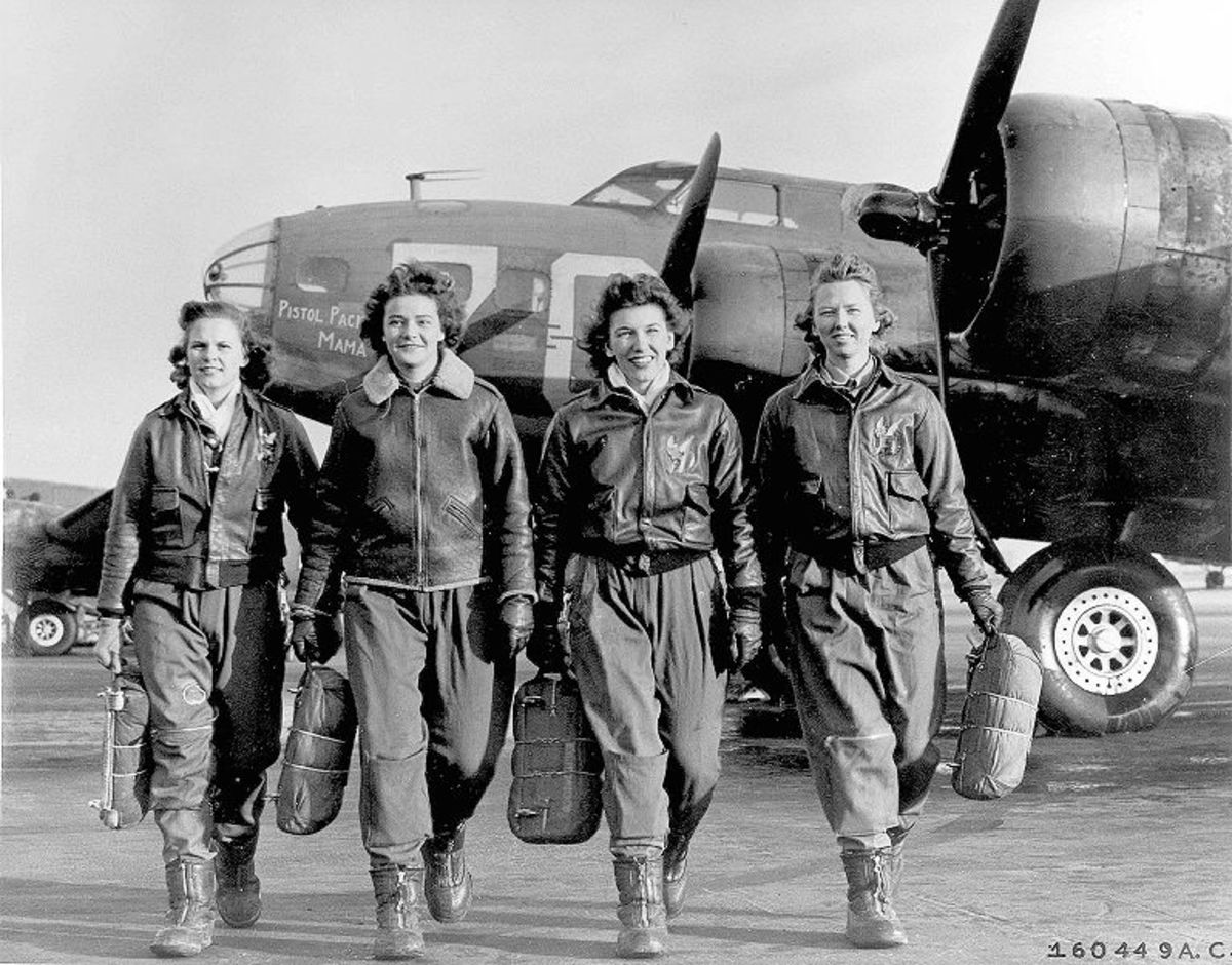 Ohio WASP Frances Green, Margaret (Peg) Kirchner, Ann Waldner, and Blanche Osborn are shown leaving their plane, the "Pistol Packin' Mama." They were trained at the school at Lockbourne Army Air Forces base in the south end of Columbus, Ohio.