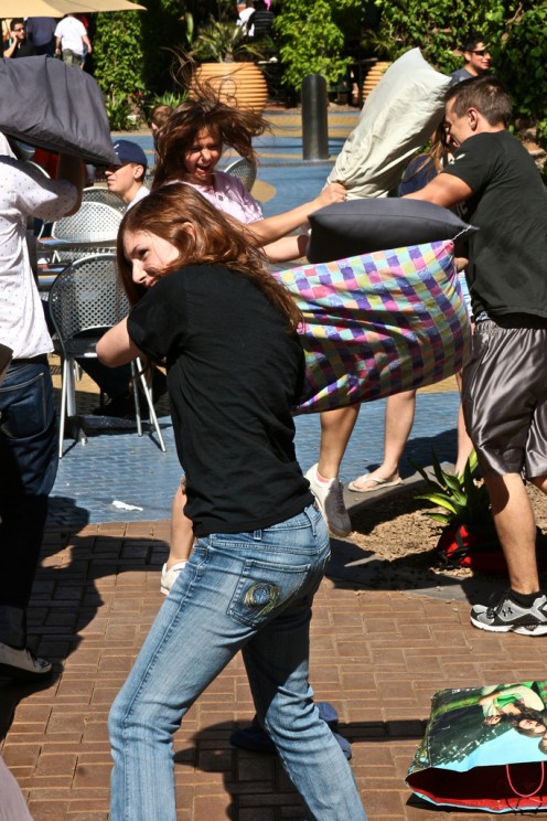 This consensual pillow fight would not count as assault. [flickr.com/photos/sheila_dee]