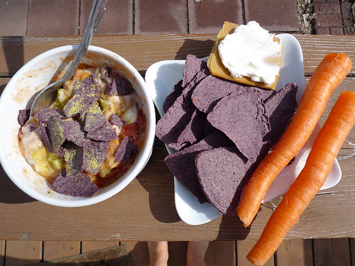 Quick Mexi dip, served with a baked tortilla chips and some carrots.