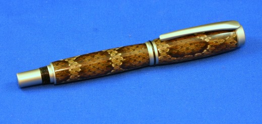 Snake skin Baron: These snake skin pens are unique. The pen is actually made from real rattlesnake skin and encapsulated in clear acrylic resin. The casting process is done by the artist.
