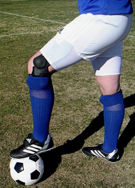 Football player wearing a knee brace