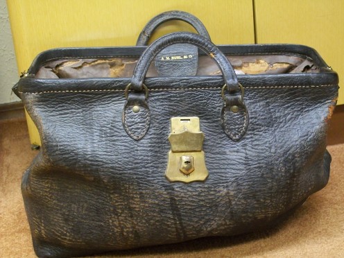 Dr. Ruhl's medical bag is stiff and corroded with age but it surely holds a bagful of memories. He carried this bag on many mercy tasks in the early 1900s. 